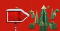 Image of christmas decorations with road sign on red background with copy space Royalty Free Stock Photo