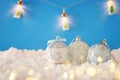 Image of christmas festive tree white ball decoration in front of blue background background. Royalty Free Stock Photo
