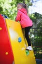 Image of climbing little girl to top of wall Royalty Free Stock Photo