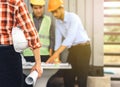 Image close behind Male architect holding a white helmet and blu