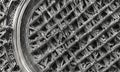 close-up view metal lattice structure reveals complex pattern interlocking squares and rectangles, creating