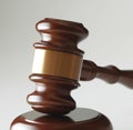 Image of close up of judge slamming gavel on grey background
