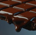 Image of close up of melting chocolate bar on dark background Royalty Free Stock Photo