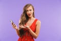 Image closeup of outraged woman 20s wearing red dress wondering