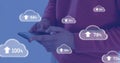 Image of cloud symbols uploading data over midsection of caucasian man using smartphone