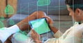Image of clouds and data processing over biracial man using tablet Royalty Free Stock Photo