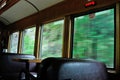 Fast Moving Train with Windows Showing Blurred Scenary Royalty Free Stock Photo