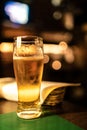 cold beer glass on bar or pub desk Royalty Free Stock Photo