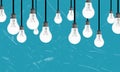 Image of a collage of black and white light bulbs, on a blue background Royalty Free Stock Photo