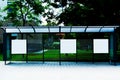 Image collage of bus shelter with white ad space panel