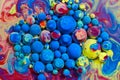Colorful range of rainbow balls floating on surface