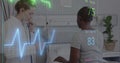 Image of colourful cardiographs over diverse female nurse and patient in hospital