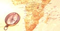 Image of compass and flickering map of africa in the background Royalty Free Stock Photo