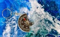 Image of compass in the water close-up Royalty Free Stock Photo