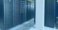 Image of computer language over data server racks Royalty Free Stock Photo