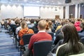 Image of a conference that takes place in a large conference room, workshop for young professionals, training in a large conferenc