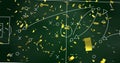 Image of confetti over game plan and sports field on board Royalty Free Stock Photo