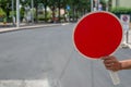 Construction worker holding a Red Stop Sign and directing traffic on the street Royalty Free Stock Photo