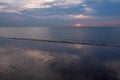 Sunset at Low Tide on a Tranquil Beach Royalty Free Stock Photo