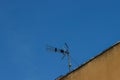 A yagi type antenna on the roof of a residential building, copy space