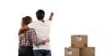 Image of couple embracing with stack of boxes on white background Royalty Free Stock Photo