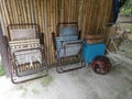 Couple of folded old lazy chair at the wooden shed. Royalty Free Stock Photo