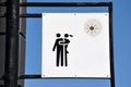 Image couple hugging on a sign in the park