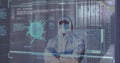 Image of covid 19 cells and man in ppe suit over computer servers Royalty Free Stock Photo