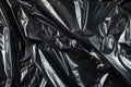 Image of Crumpled sheet of black polythene plastic wrap. Texture for background usage Royalty Free Stock Photo