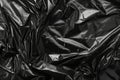 Image of Crumpled sheet of black polythene plastic wrap. Texture for background usage Royalty Free Stock Photo