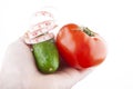 Image of cucumber tomato hand white background Royalty Free Stock Photo