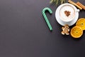 Image of cup of cappuccino coffee and christmas gingerbread man with copy space on grey Royalty Free Stock Photo
