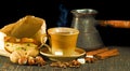 Image of cup of coffee, cookies, coffee beans and cinnamon close-up Royalty Free Stock Photo