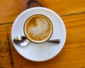 Image of cup of fresh coffee cortado on table