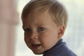 Image of cute baby boy, closeup portrait of adorable child on blurred background, sweet toddler with blue eyes, healthy Royalty Free Stock Photo