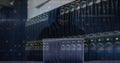 Image of cyberattack over server room and hacker using laptop Royalty Free Stock Photo