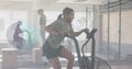 Image of data processing on interface over caucasian woman cross training on elliptical at gym Royalty Free Stock Photo