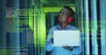 Image of data processing over african american male engineer using laptop at server room