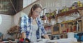 Image of data processing over caucasian female carpenter working in workshop Royalty Free Stock Photo