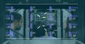 Image of data processing over diverse workers in server room Royalty Free Stock Photo