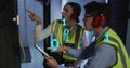 Image of data processing over diverse workers using tablet in server room Royalty Free Stock Photo