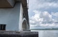 daytime scene activity around the concrete bridge.