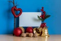 Decoration for Christmas and New Year Greeting Card With Two Decorative Balls, Christmas Bell and Walnuts Royalty Free Stock Photo