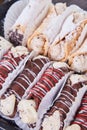 Delicious bakery canolli tray with chocolate or powdered sugar Royalty Free Stock Photo