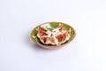 Image of delicious figs or brevas with coconut on a green ceramic bowl