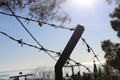 Barbed Wire Barrier: Symbol of Defense and Division