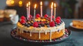 Joyful Birthday Cake Illuminated by Candles for Festive Celebrations Royalty Free Stock Photo