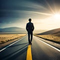 Business man walking down a country road at sunset Royalty Free Stock Photo