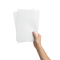 Hand holding stack of blank white paper sheets Royalty Free Stock Photo