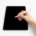 Hand using stylus on digital tablet screen Royalty Free Stock Photo